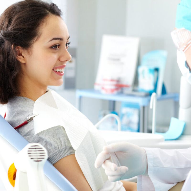Patient smiling during dental consultation.
