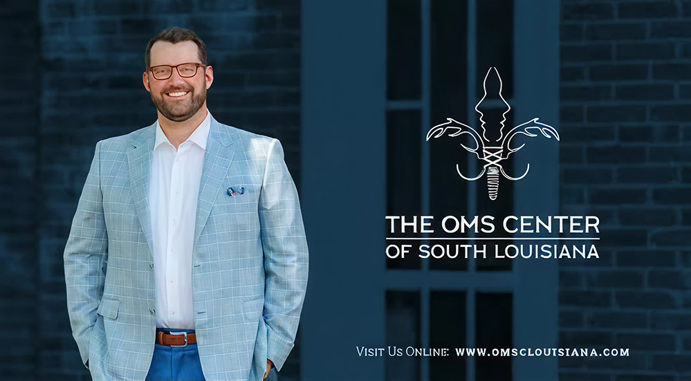 Professional man standing in front of OMS Center.