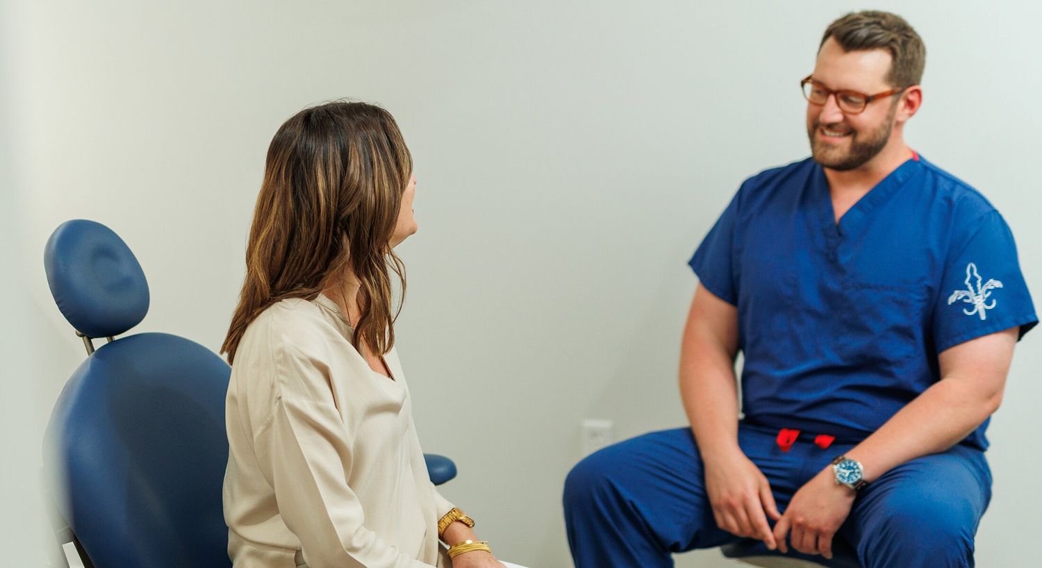 Doctor consulting with patient in medical office.