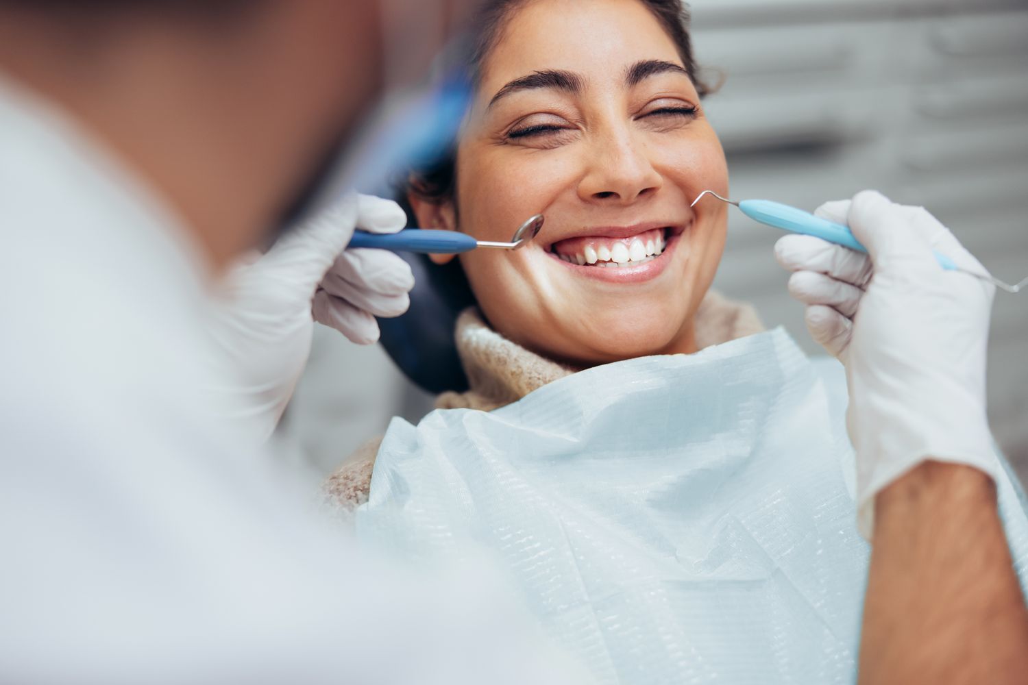Patient smiling during a dental check-up.